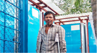 Man standing by public toilet